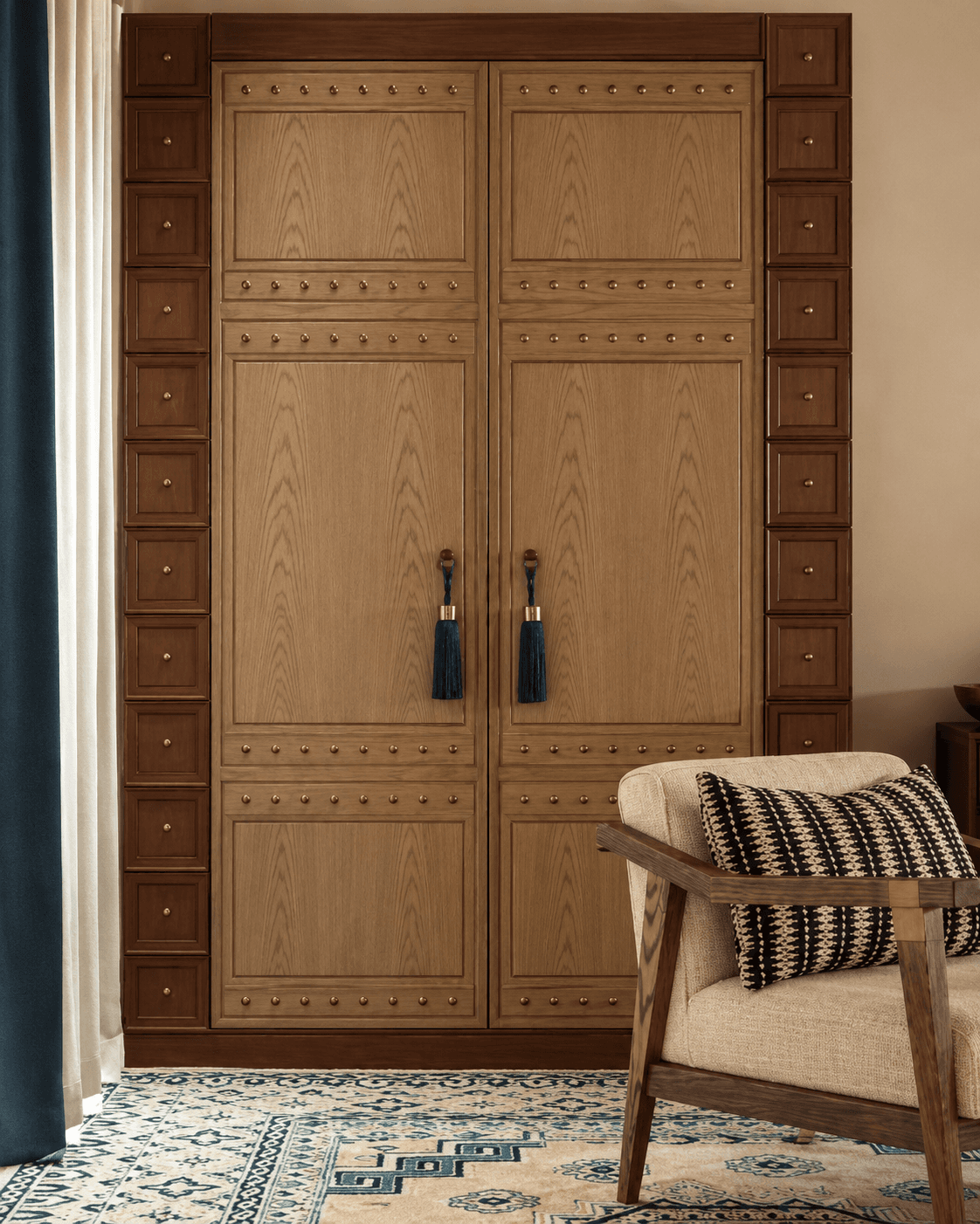 Classic Studded Panel Double Main Door displayed in an elegant living room, featuring framed wooden panels, metallic stud detailing and dark tassel-style pulls.