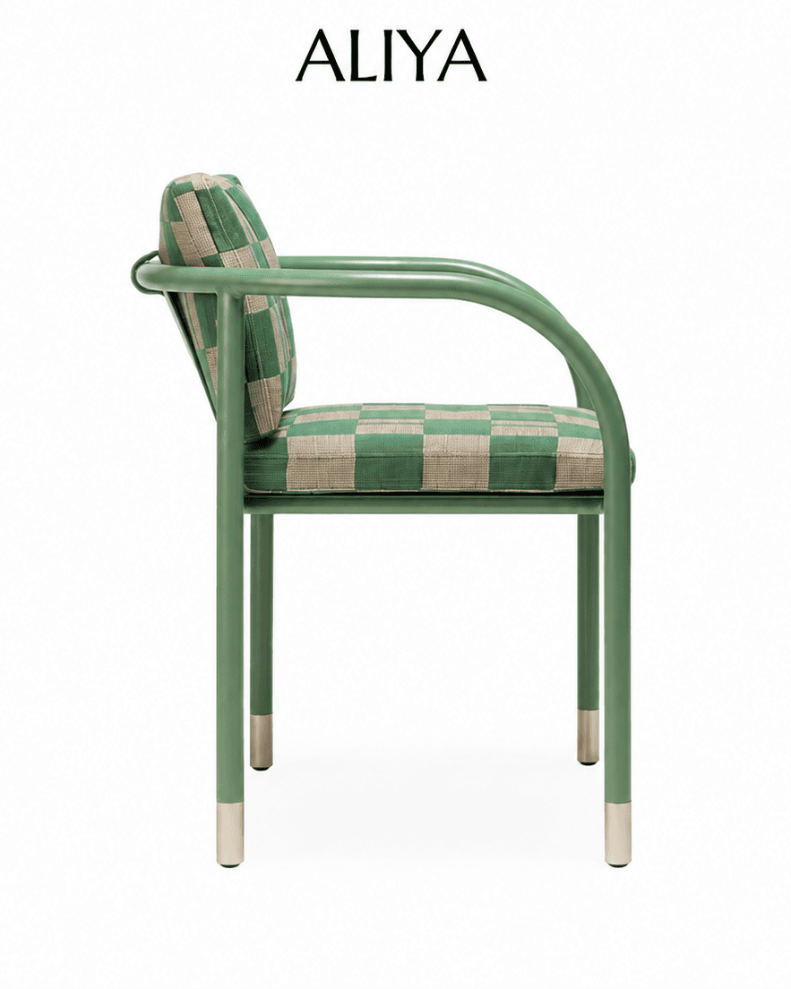ALIYA dining armchair with a sage-green curved metal frame and green-and-beige patterned upholstery, shown in side profile.